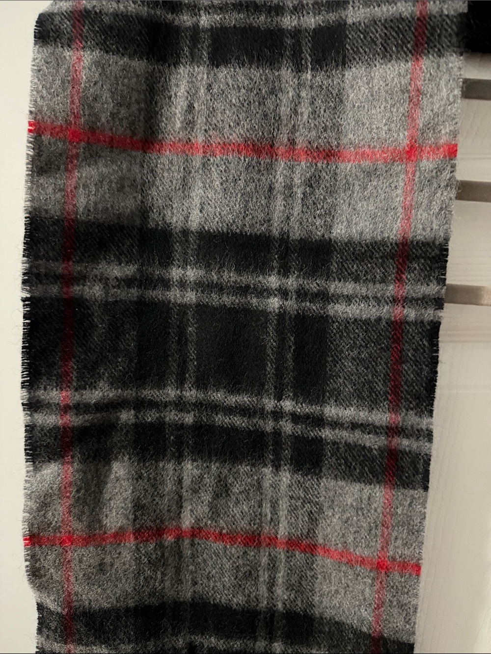 This is a Lochcarron of Scotland 100% lambswool tartan scarf in grey